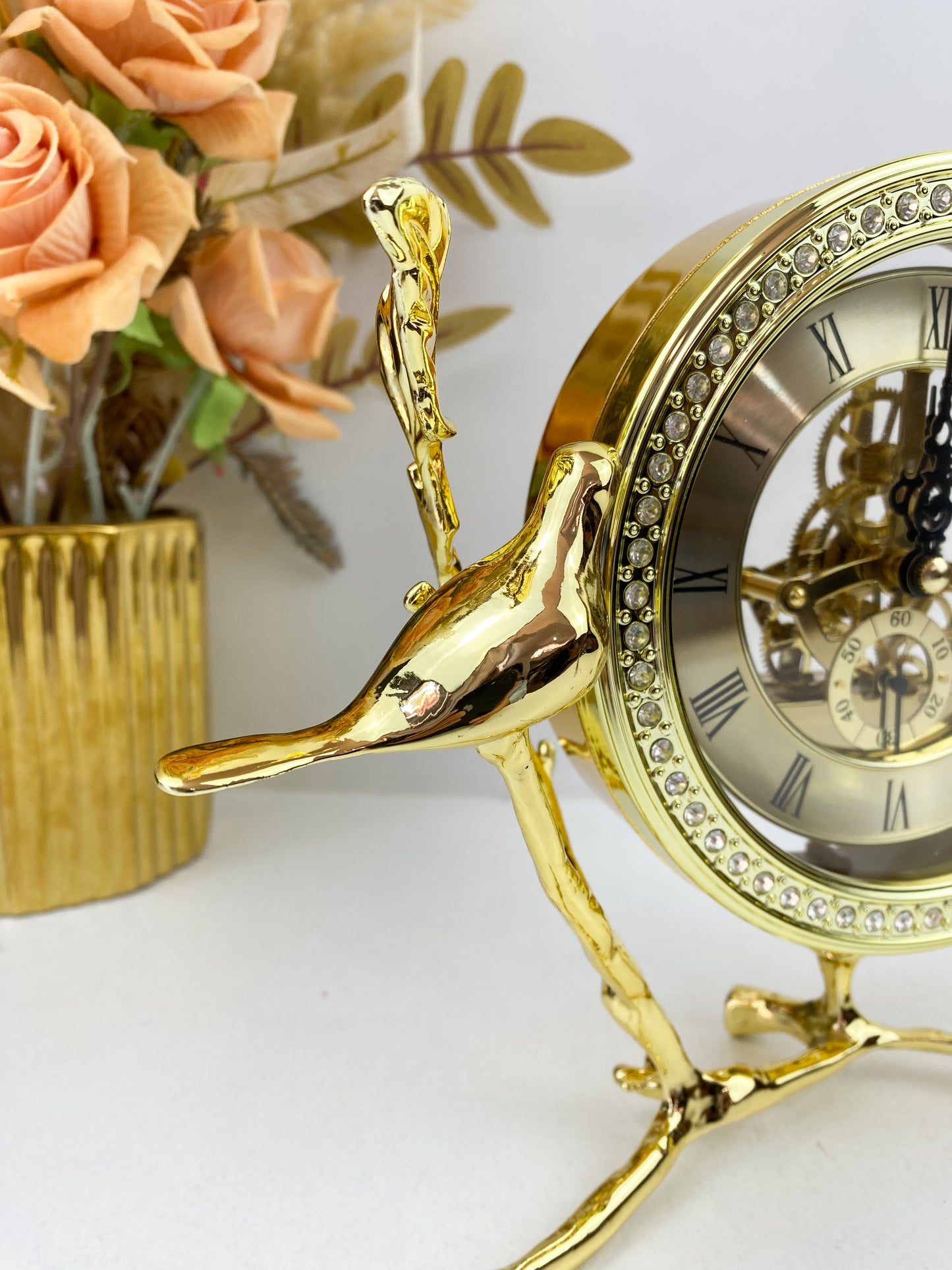 Horloge sculpture d'oiseau en laiton