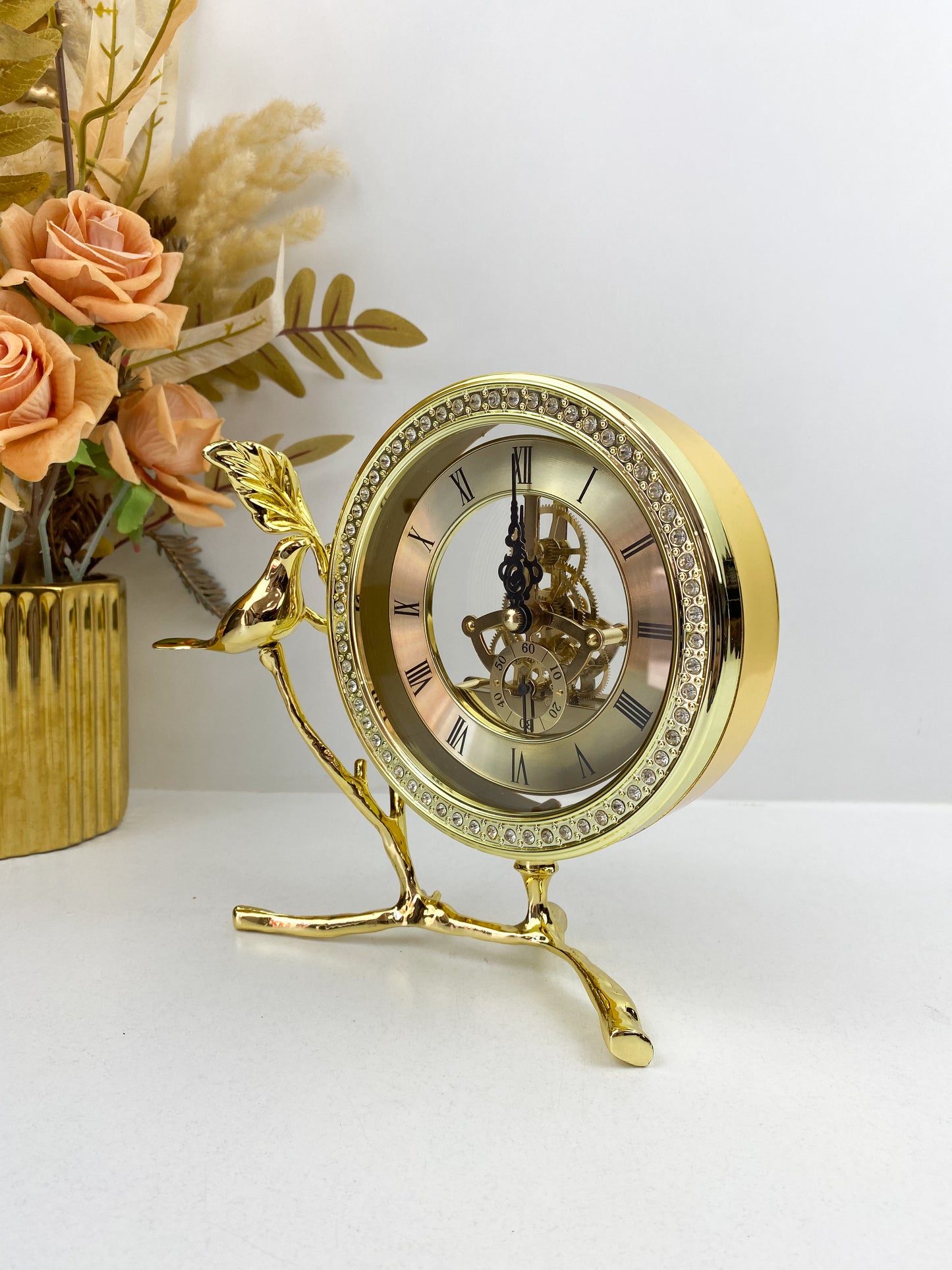 Horloge sculpture d'oiseau en laiton
