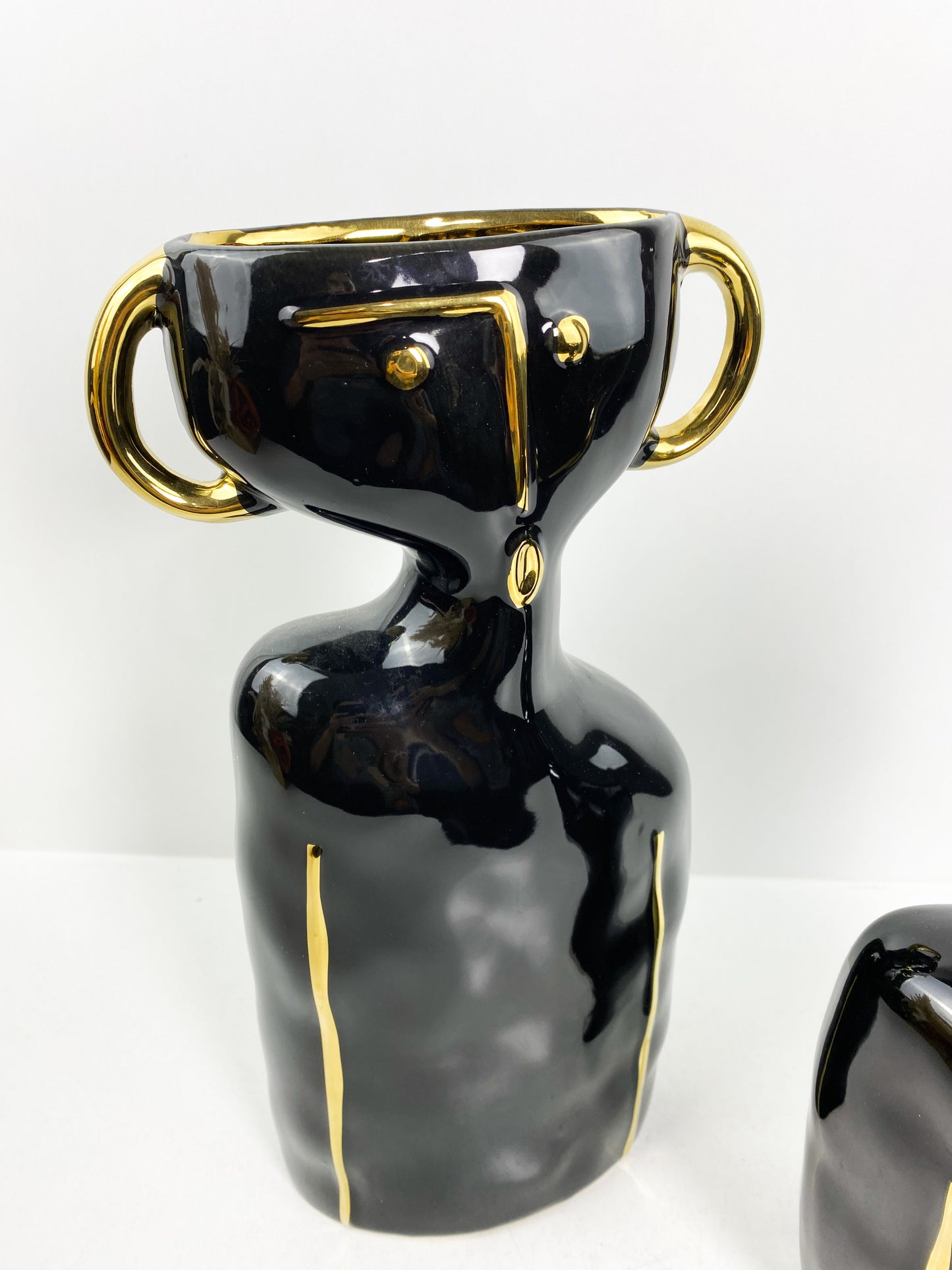 Duo vase noir visage détailles dorée