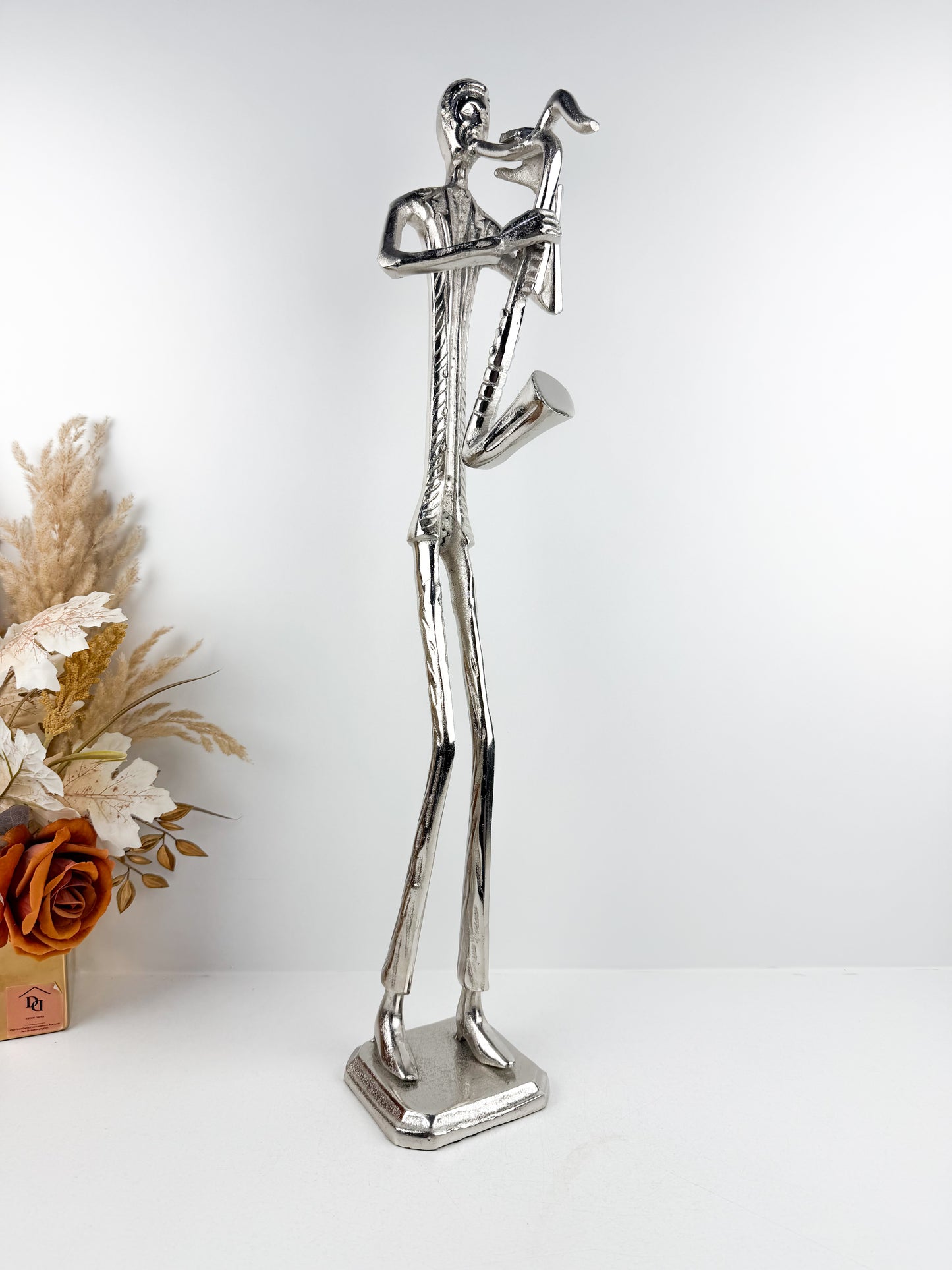 Figurine musicien de saxophone argentée en métal