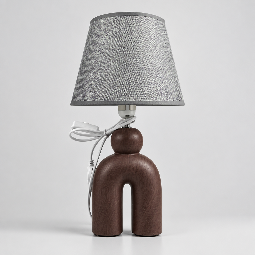 Lampe à Poser Sculpturale de pied en céramique mat d'un abat-Jour gris texturé.