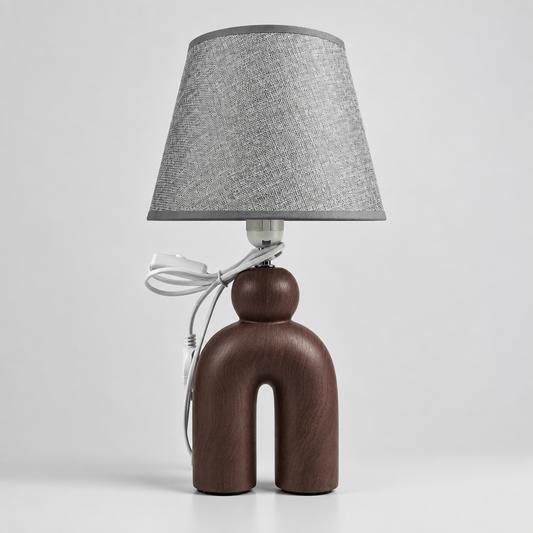 Lampe à Poser Sculpturale de pied en céramique mat d'un abat-Jour gris texturé.