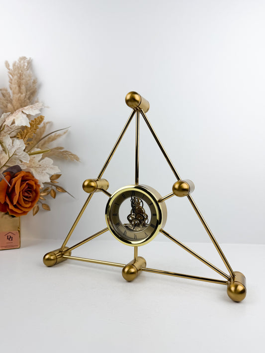 Horloge triangulaire mécanique en métal doré