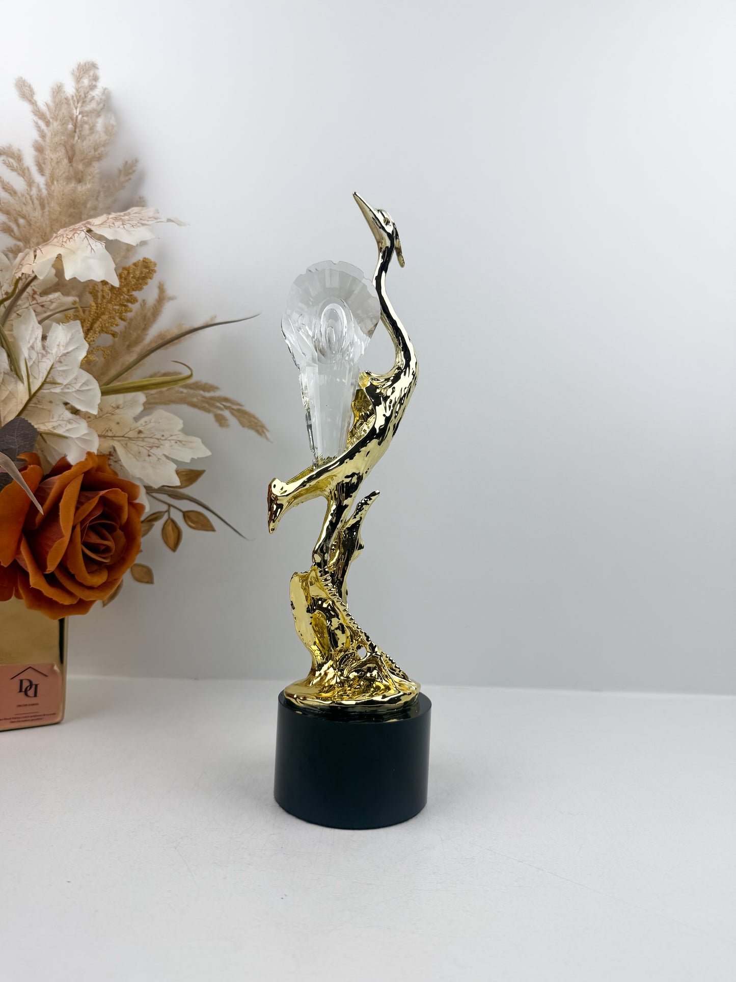 figurine représentant un héron stylisé aux détails ciselés