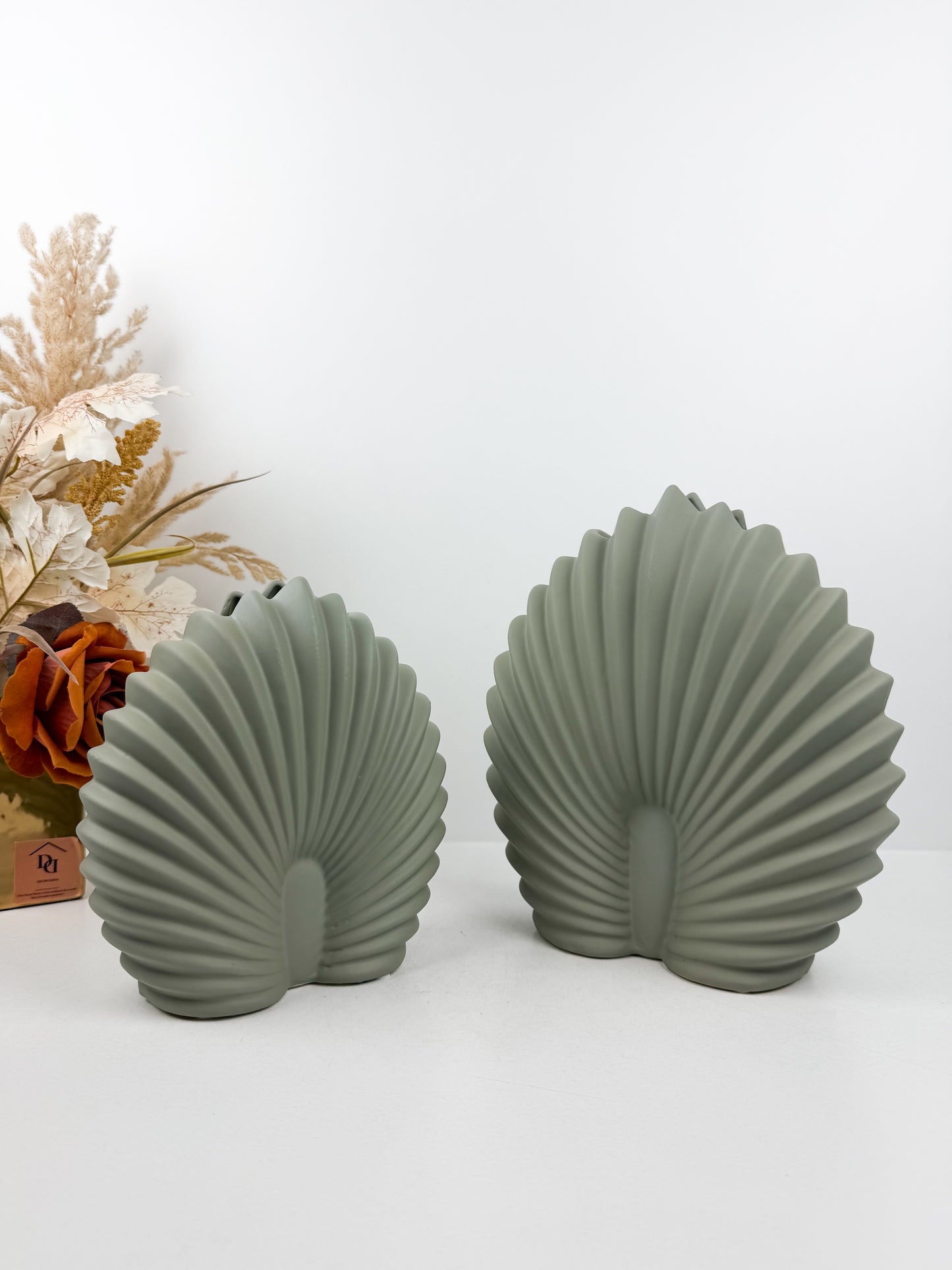 Vase décoratif céramique en forme de coquillage en vert