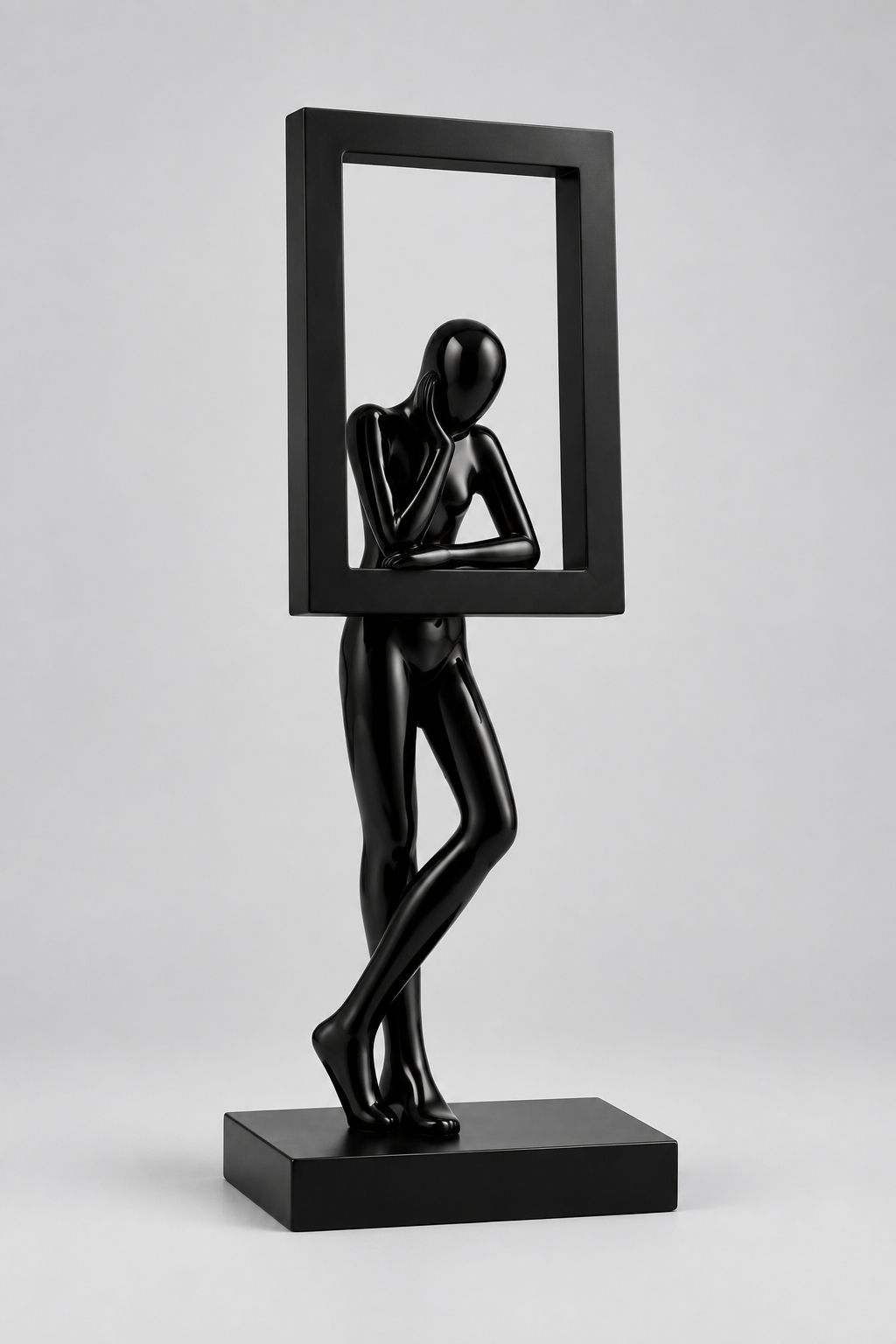 Sculpture décorative dans un cadre rectangulaire géométrique en résine.