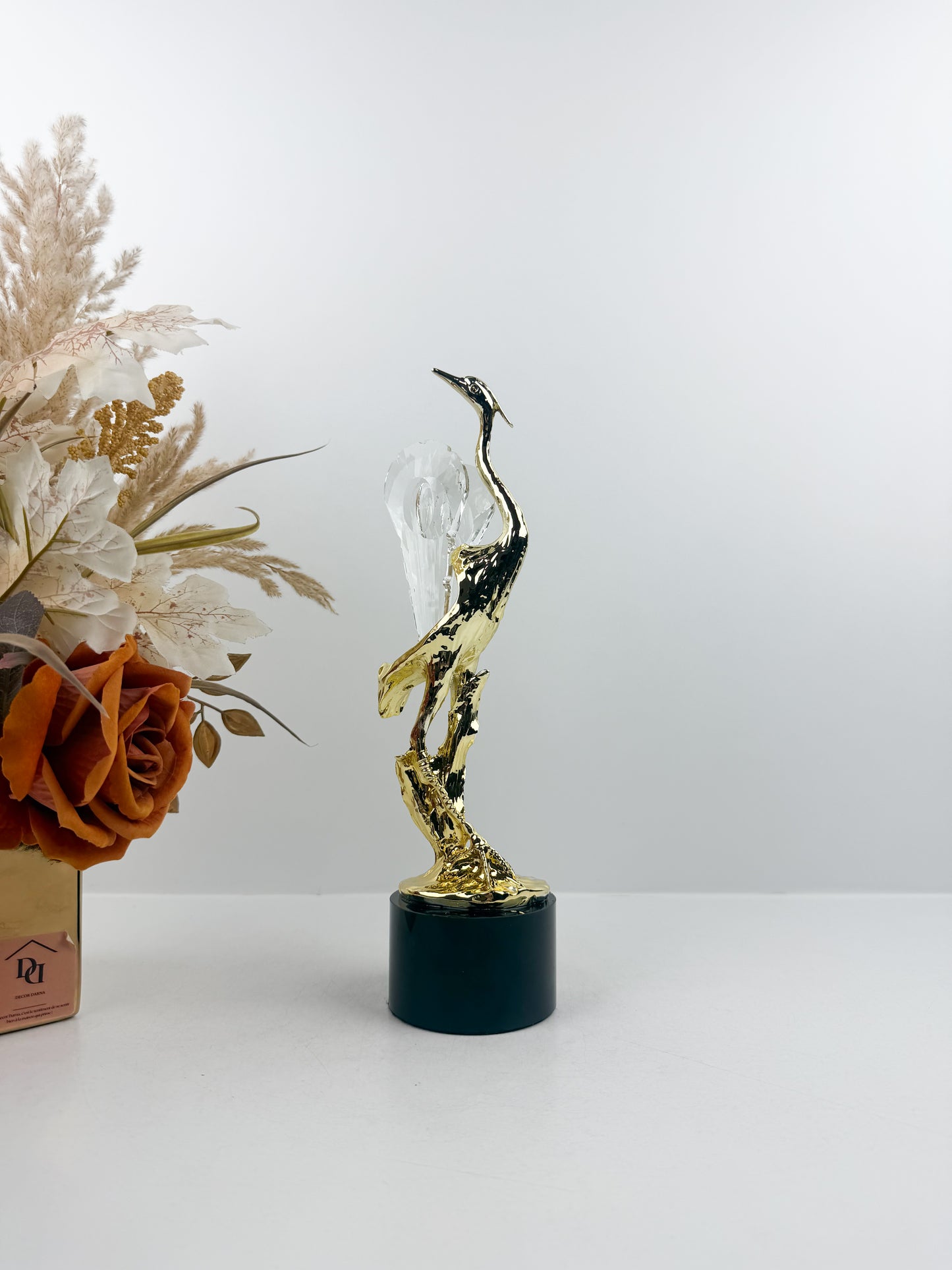 figurine représentant un héron stylisé aux détails ciselés